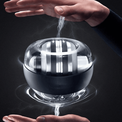 A gyro ball being manipulated by hands with a glowing effect. Display on dark background.